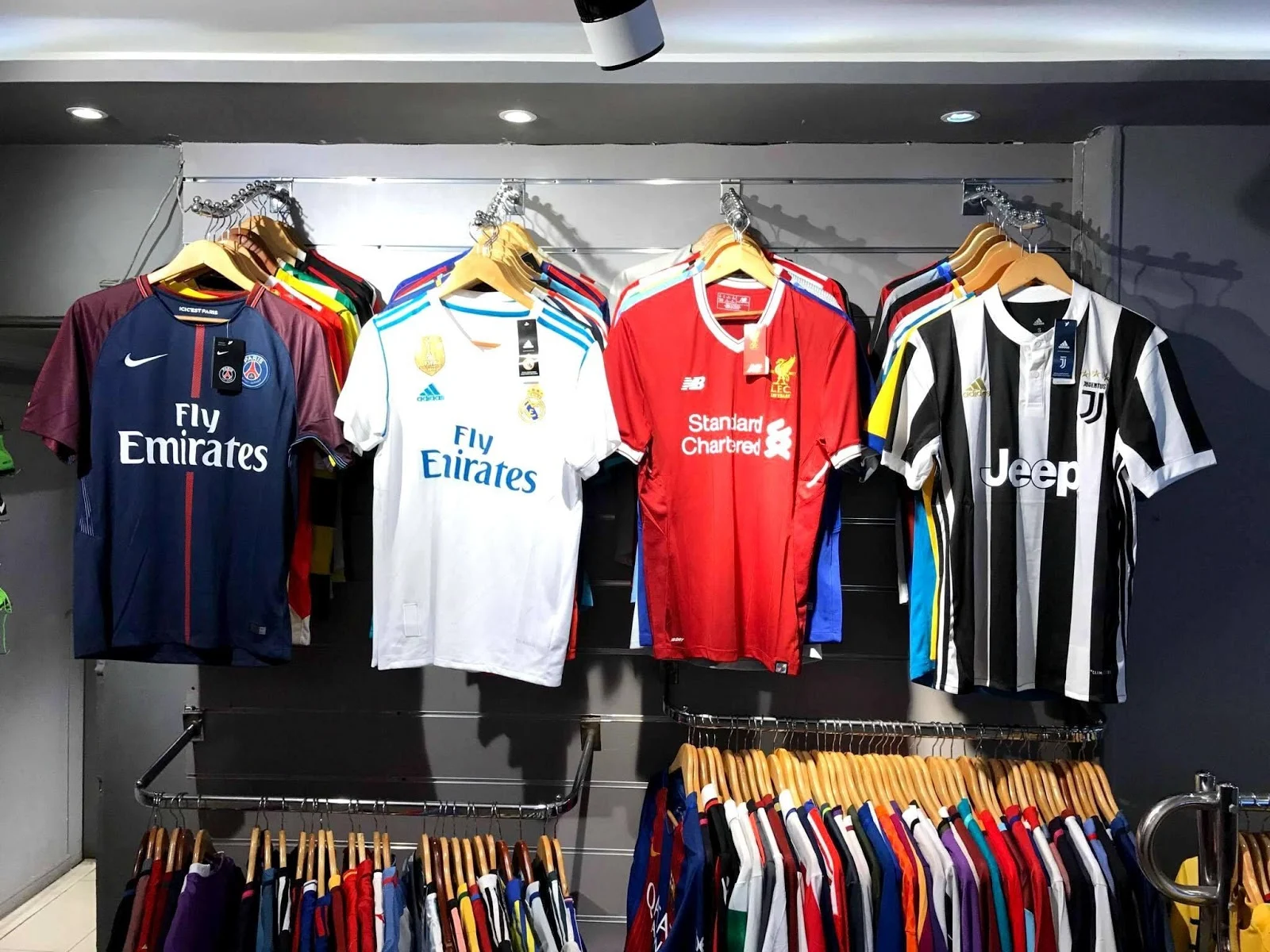 Interior view of Mike's Jersey Store showing jersey displays and customers shopping
